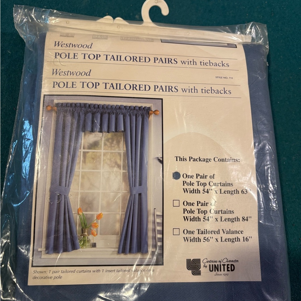Set of brand new blue Curtain panels with tie backs